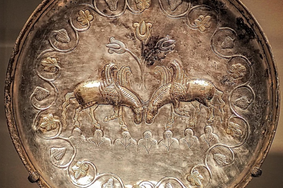 Colorful silk textiles laid out, symbolizing the ancient Silk Road journey